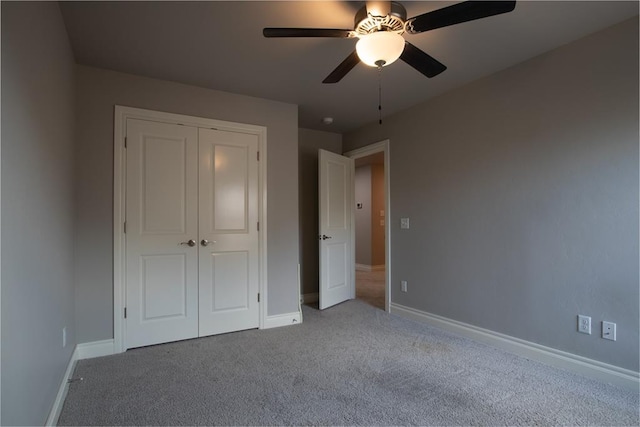 12916 Ponderosa Blvd, Oklahoma City, OK 73142 - unfurnished bedroom featuring carpet floors, a closet, baseboards, and ceiling fan