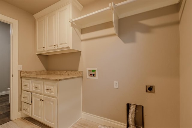 12916 Ponderosa Blvd, Oklahoma City, OK 73142 - washroom with hookup for an electric dryer, cabinet space, hookup for a washing machine, baseboards, and light wood-style floors