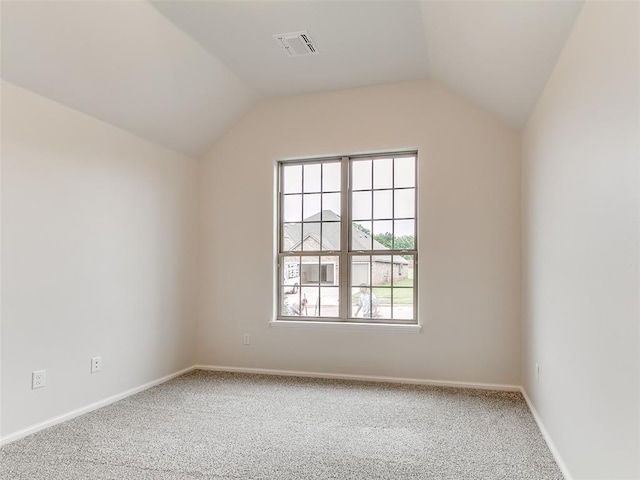 14613 Brantwood Cir, Oklahoma City, OK 73142 - additional living space featuring carpet floors, healthy amount of natural light, vaulted ceiling, and baseboards