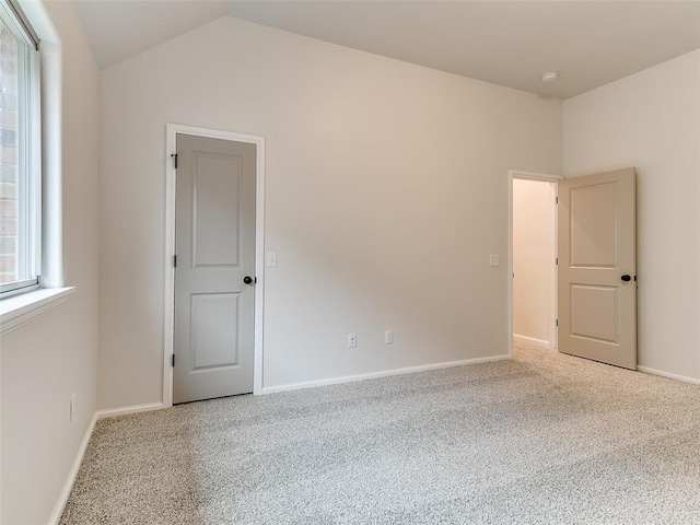 14613 Brantwood Cir, Oklahoma City, OK 73142 - spare room with vaulted ceiling, carpet, and baseboards