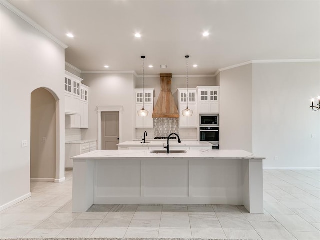 14613 Brantwood Cir, Oklahoma City, OK 73142 - kitchen with premium range hood, stainless steel appliances, a large island, tasteful backsplash, and a sink