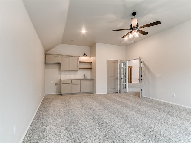 14613 Brantwood Cir, Oklahoma City, OK 73142 - unfurnished living room with ceiling fan, french doors, lofted ceiling, light colored carpet, and baseboards