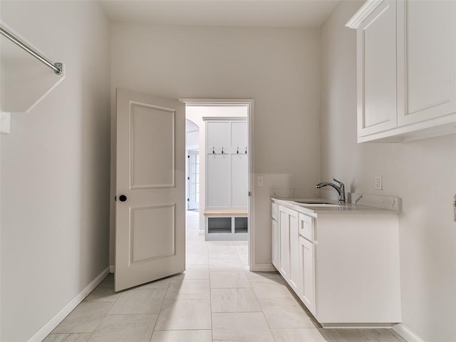 14613 Brantwood Cir, Oklahoma City, OK 73142 - washroom with a sink and baseboards