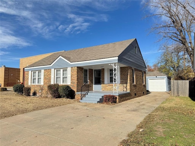 3117 NW 23rd St, Oklahoma City, OK 73107 - view of front of house with brick siding, covered porch, driveway, and an outdoor structure