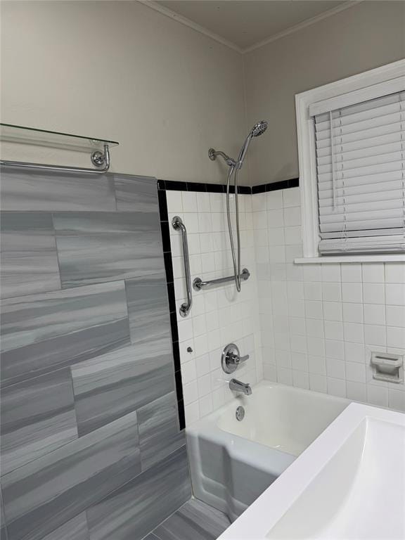 3117 NW 23rd St, Oklahoma City, OK 73107 - bathroom featuring shower / washtub combination, crown molding, and tile walls