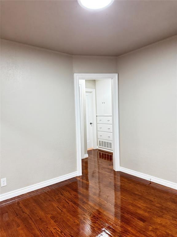 3117 NW 23rd St, Oklahoma City, OK 73107 - spare room with wood finished floors and baseboards
