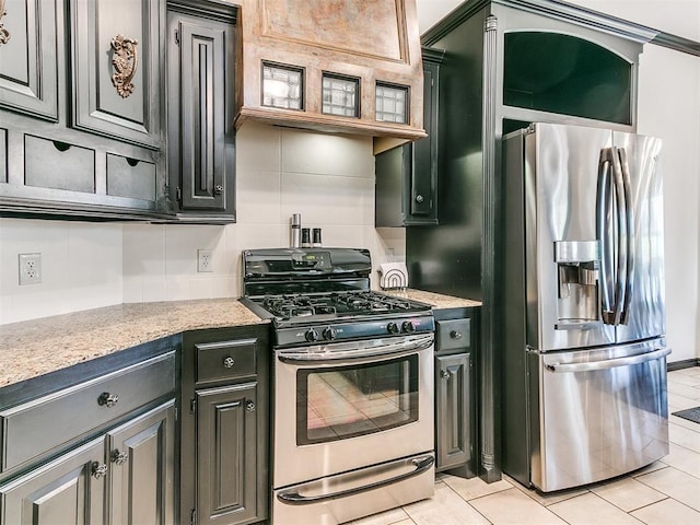 2708 SE 39th St, Moore, OK 73160 - kitchen with appliances with stainless steel finishes and light tile patterned flooring