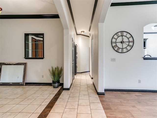 2708 SE 39th St, Moore, OK 73160 - hall with arched walkways, baseboards, ornamental molding, and light tile patterned floors