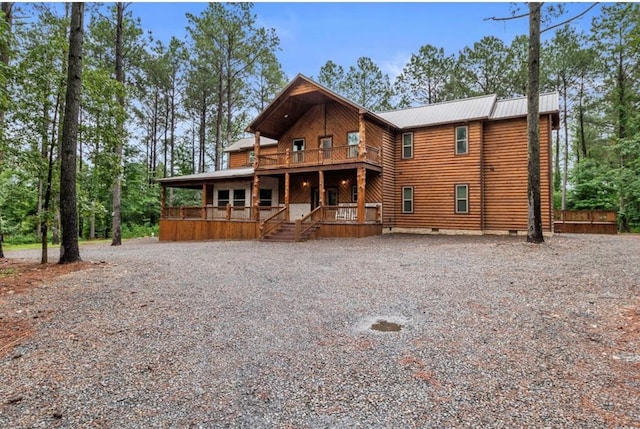 31 Conifer Crossing Trl, Broken Bow, OK 74728 - rustic home featuring a porch, crawl space, driveway, and a metal roof