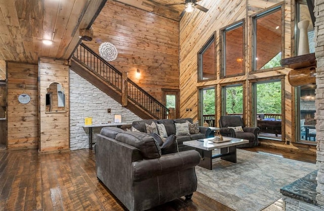 31 Conifer Crossing Trl, Broken Bow, OK 74728 - living room featuring wood ceiling, high vaulted ceiling, wood walls, wood-type flooring, and a ceiling fan