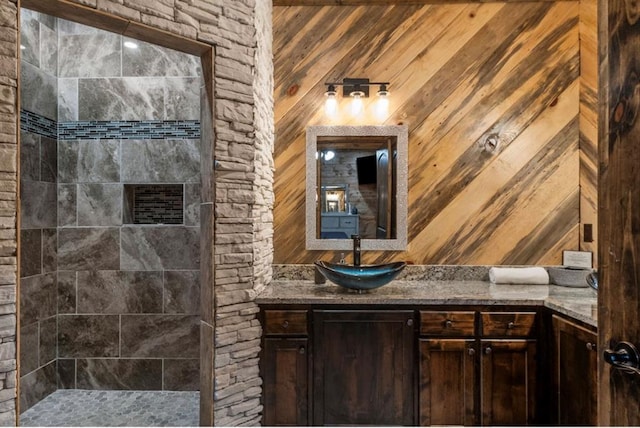 31 Conifer Crossing Trl, Broken Bow, OK 74728 - full bath featuring vanity, a tile shower, and wood walls