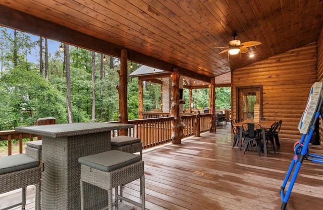 31 Conifer Crossing Trl, Broken Bow, OK 74728 - wooden terrace featuring outdoor dining area and a ceiling fan
