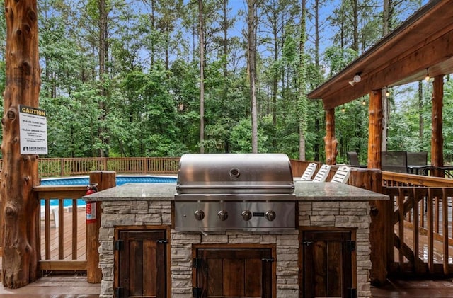 31 Conifer Crossing Trl, Broken Bow, OK 74728 - view of patio with area for grilling and a wooden deck