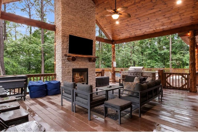 31 Conifer Crossing Trl, Broken Bow, OK 74728 - deck featuring an outdoor living space with a fireplace, a ceiling fan, and area for grilling