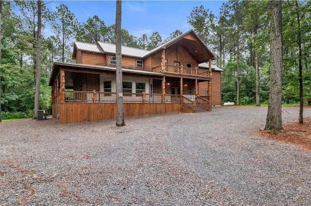 31 Conifer Crossing Trl, Broken Bow, OK 74728 - rustic home featuring driveway, a metal roof, and a porch