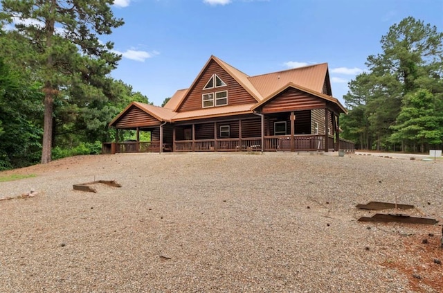 170 Driftcast Rd, Broken Bow, OK 74728 - view of front of property with covered porch, metal roof, and faux log siding