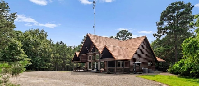 170 Driftcast Rd, Broken Bow, OK 74728 - view of side of property featuring metal roof, a deck, and log veneer siding