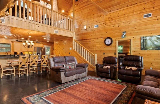 170 Driftcast Rd, Broken Bow, OK 74728 - living room featuring wooden walls, stairway, a high ceiling, a chandelier, and wooden ceiling