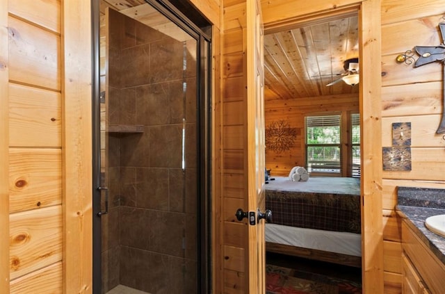 170 Driftcast Rd, Broken Bow, OK 74728 - ensuite bathroom with vanity, a stall shower, wood ceiling, wooden walls, and a ceiling fan