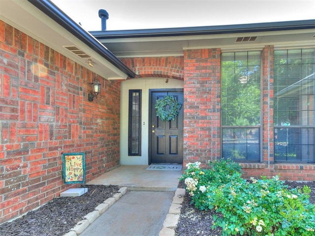 16716 Valley Crst, Edmond, OK 73012 - entrance to property featuring brick siding and covered porch