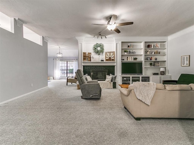 16716 Valley Crst, Edmond, OK 73012 - carpeted living room featuring ceiling fan, a fireplace, and baseboards