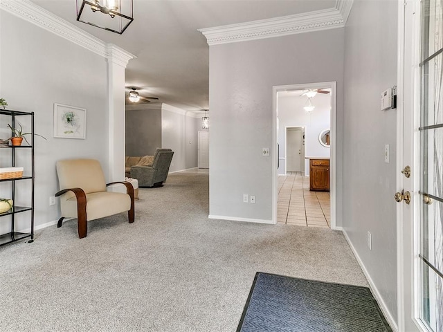 16716 Valley Crst, Edmond, OK 73012 - living area with ornamental molding, ceiling fan, carpet floors, baseboards, and decorative columns