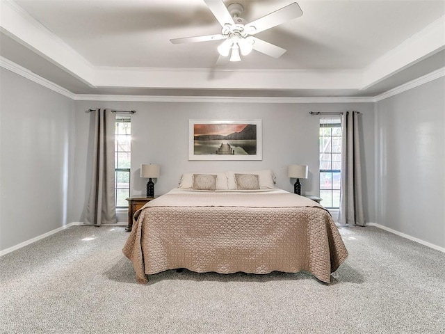 16716 Valley Crst, Edmond, OK 73012 - bedroom with a raised ceiling, carpet, multiple windows, and ornamental molding