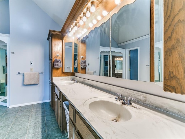 16716 Valley Crst, Edmond, OK 73012 - full bath featuring lofted ceiling, double vanity, baseboards, tile patterned floors, and ornamental molding