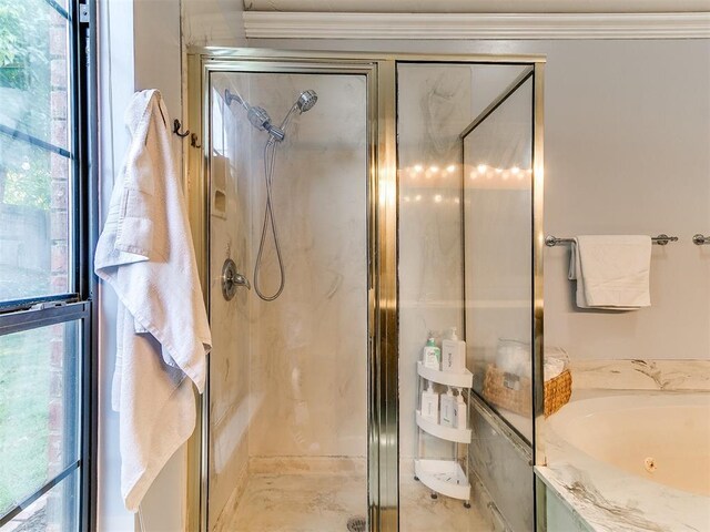 16716 Valley Crst, Edmond, OK 73012 - full bathroom featuring plenty of natural light, a shower stall, a whirlpool tub, and crown molding