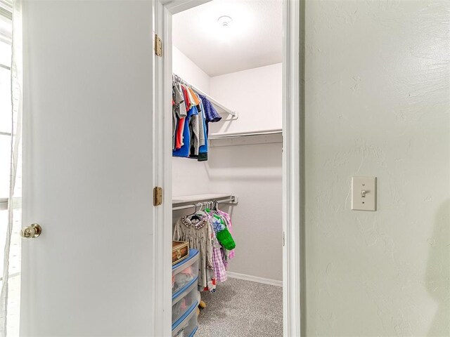 16716 Valley Crst, Edmond, OK 73012 - walk in closet featuring carpet flooring