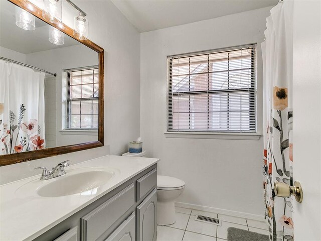 16716 Valley Crst, Edmond, OK 73012 - bathroom featuring tile patterned floors, vanity, toilet, baseboards, and a shower with shower curtain