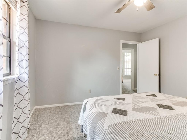 16716 Valley Crst, Edmond, OK 73012 - carpeted bedroom featuring ceiling fan and baseboards