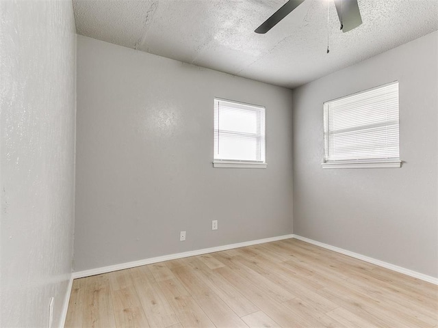 2713 SW 75th St, Oklahoma City, OK 73159 - spare room featuring ceiling fan, wood finished floors, and baseboards