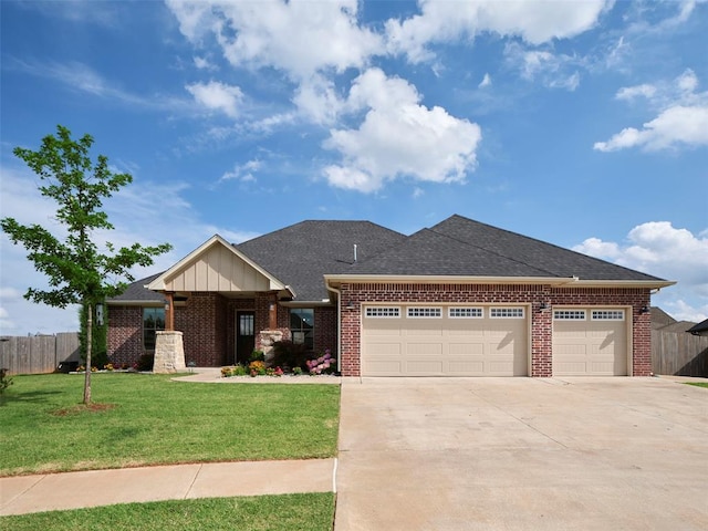 4304 NW 154th Pl, Edmond, OK 73013 - view of front of home featuring an attached garage, brick siding, concrete driveway, and board and batten siding