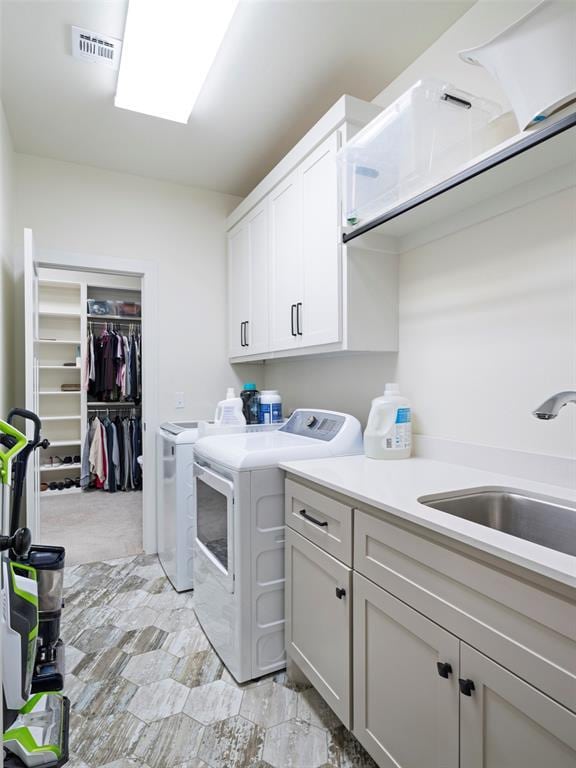 4304 NW 154th Pl, Edmond, OK 73013 - washroom featuring cabinet space and washing machine and clothes dryer