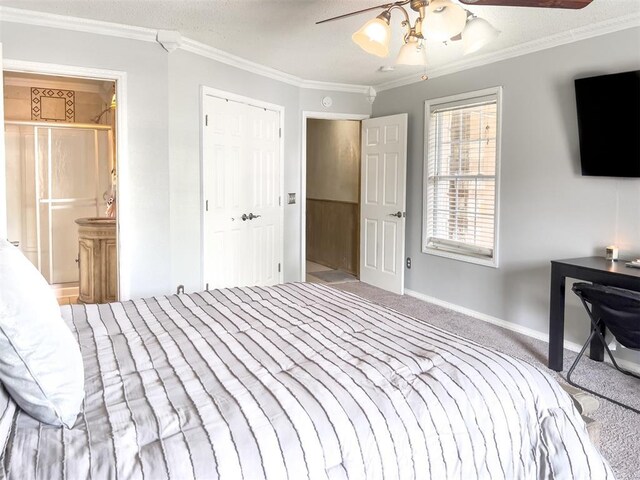 1117 SW 37th St, Oklahoma City, OK 73109 - bedroom with carpet floors, crown molding, baseboards, ensuite bath, and ceiling fan