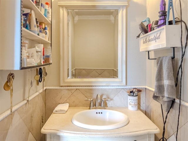 1117 SW 37th St, Oklahoma City, OK 73109 - bathroom featuring vanity, tile walls, and ornamental molding