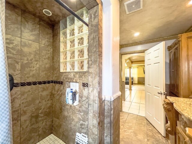1117 SW 37th St, Oklahoma City, OK 73109 - full bath with tiled shower, tile patterned flooring, and ornamental molding