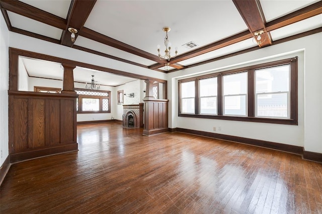 1505 NW 34th St, Oklahoma City, OK 73118 - unfurnished living room featuring a chandelier, baseboards, coffered ceiling, beam ceiling, and dark wood finished floors