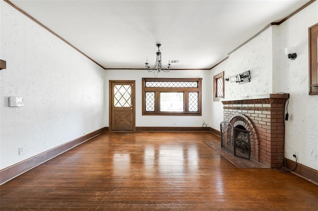 1505 NW 34th St, Oklahoma City, OK 73118 - unfurnished living room with a chandelier, wood-type flooring, crown molding, a fireplace, and baseboards