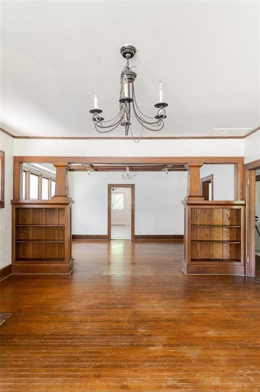 1505 NW 34th St, Oklahoma City, OK 73118 - spare room with a chandelier, crown molding, baseboards, and wood finished floors
