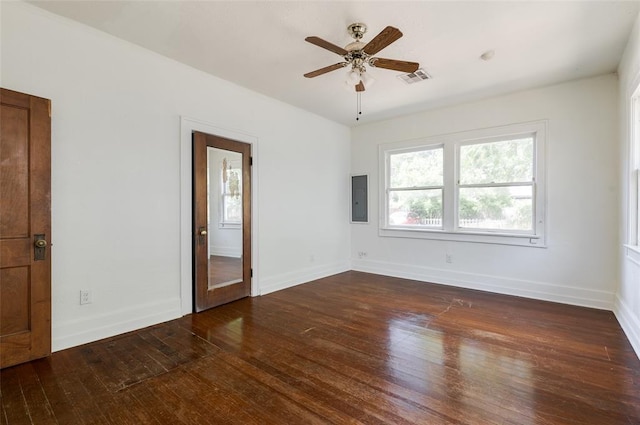 1505 NW 34th St, Oklahoma City, OK 73118 - unfurnished room with electric panel, wood-type flooring, a ceiling fan, and baseboards