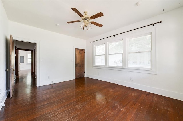 1505 NW 34th St, Oklahoma City, OK 73118 - empty room featuring baseboards, dark wood finished floors, plenty of natural light, and a ceiling fan