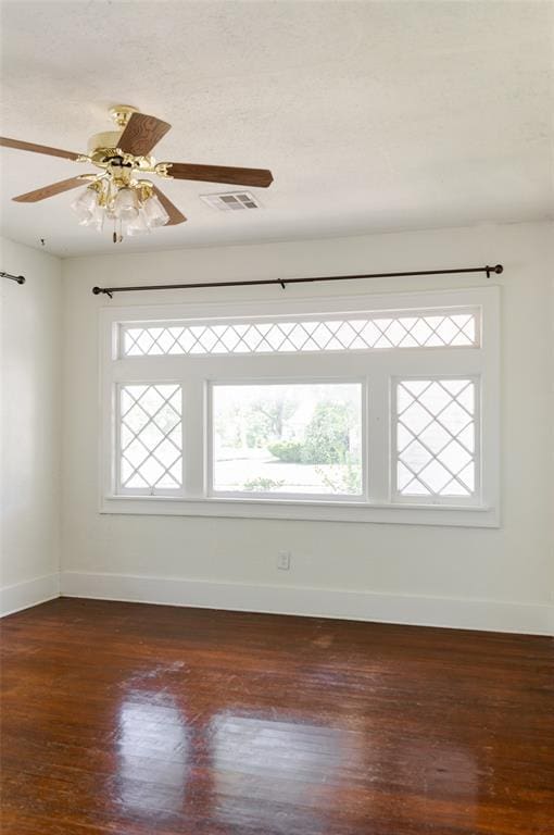 1505 NW 34th St, Oklahoma City, OK 73118 - spare room featuring plenty of natural light, baseboards, and dark wood-style flooring