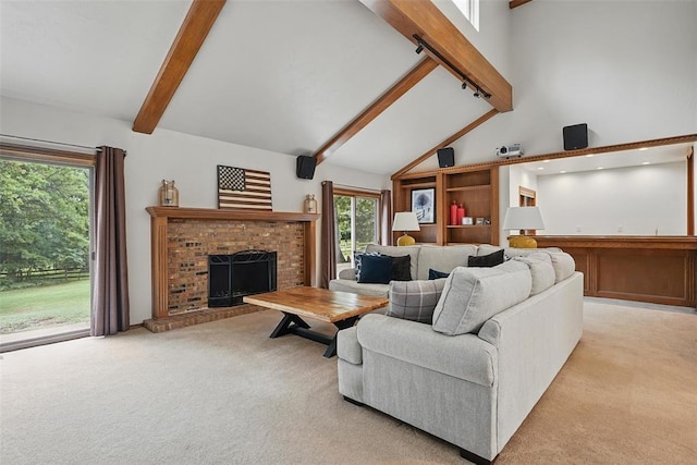 2108 Woodhill Rd, Edmond, OK 73025 - living area featuring light carpet, beamed ceiling, high vaulted ceiling, and a fireplace