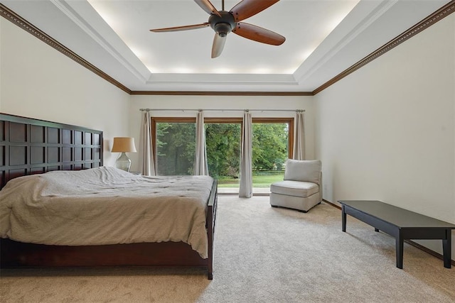 2108 Woodhill Rd, Edmond, OK 73025 - bedroom featuring a tray ceiling, carpet, access to exterior, and a ceiling fan