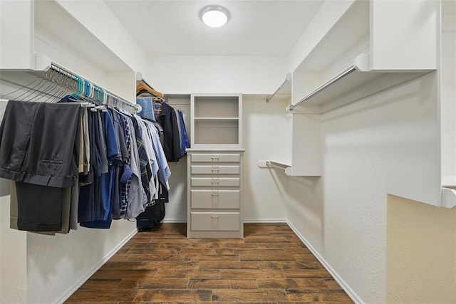 2108 Woodhill Rd, Edmond, OK 73025 - walk in closet with dark wood-style floors