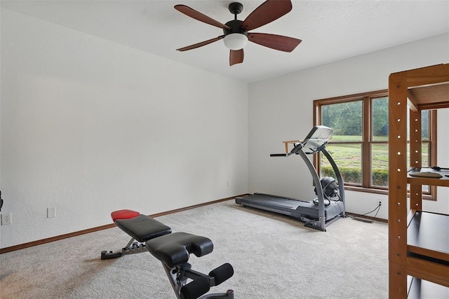 2108 Woodhill Rd, Edmond, OK 73025 - workout room with carpet flooring, ceiling fan, and baseboards