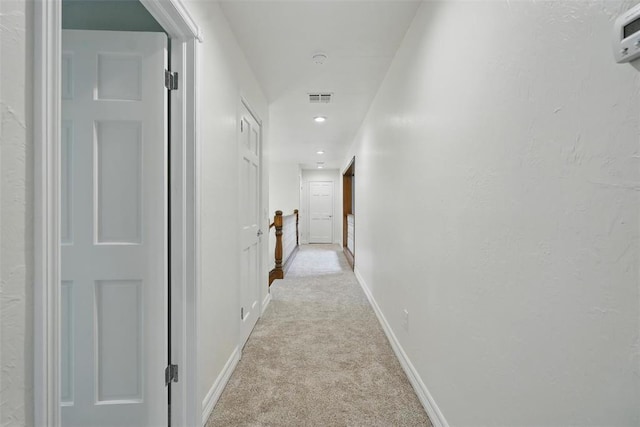 2108 Woodhill Rd, Edmond, OK 73025 - hall with light colored carpet, baseboards, and recessed lighting