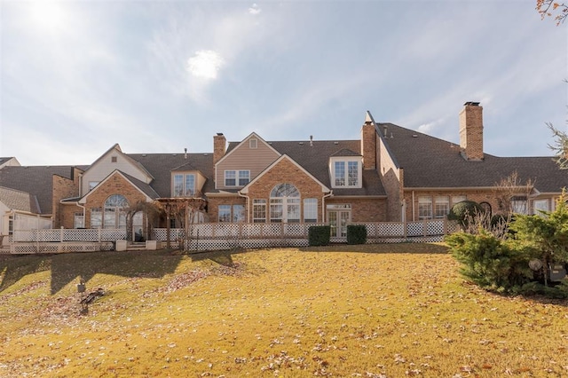 607 Aberdeen Rd, Edmond, OK 73025 - rear view of house with brick siding, french doors, and a chimney